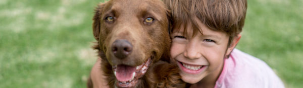 Happy boy with his adopted dog